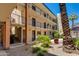 Multi-level building with balconies, landscaped courtyard and staircase access at 4727 E Lafayette Blvd # 211, Phoenix, AZ 85018