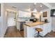 Compact kitchen featuring butcher block counters, white cabinets, and stainless steel appliances at 4727 E Lafayette Blvd # 211, Phoenix, AZ 85018