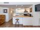 Compact kitchen featuring butcher block counters, white cabinets, and stainless steel appliances at 4727 E Lafayette Blvd # 211, Phoenix, AZ 85018