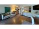 Bright living area with a comfortable sofa, kitchen access, a dining area and wood-look floors at 4727 E Lafayette Blvd # 211, Phoenix, AZ 85018