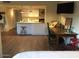 Open-concept living area with a breakfast bar, a kitchen, and a dining and lounge space at 4727 E Lafayette Blvd # 211, Phoenix, AZ 85018