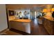Open concept living area featuring a breakfast bar, and a comfortable bedroom area at 4727 E Lafayette Blvd # 211, Phoenix, AZ 85018