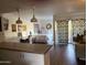 Bright living area with a comfortable sofa, a bed, and a functional workspace at 4727 E Lafayette Blvd # 211, Phoenix, AZ 85018