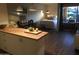 Open concept living area showcasing a modern kitchen and comfortable bedroom space at 4727 E Lafayette Blvd # 211, Phoenix, AZ 85018