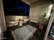 Cozy patio featuring a patterned rug, comfortable seating, and lush potted plants at 4727 E Lafayette Blvd # 211, Phoenix, AZ 85018