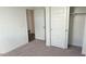 Bright bedroom with closet space, neutral carpeting, and an attached room at 48402 N Duran Way, Gold Canyon, AZ 85118