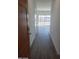 Inviting entryway with a modern door, wood-look flooring, and lots of natural light at 48402 N Duran Way, Gold Canyon, AZ 85118
