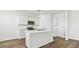 Modern kitchen featuring white cabinets, stainless steel appliances, and a center island at 48402 N Duran Way, Gold Canyon, AZ 85118