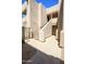 Modern condo exterior showcasing a secure entryway with unit numbers and well-maintained landscaping at 5035 N 17Th Ave # 205, Phoenix, AZ 85015