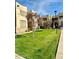 Landscaped exterior featuring well-maintained lawns and mature trees at 5035 N 17Th Ave # 205, Phoenix, AZ 85015