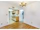 Bright open kitchen with clean white cabinets, essential appliances, and access to laundry at 5035 N 17Th Ave # 205, Phoenix, AZ 85015