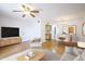 Cozy living area with hardwood floors, a ceiling fan, and access to the dining area at 5035 N 17Th Ave # 205, Phoenix, AZ 85015