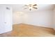 Bright, open living room with beautiful wood floors, ceiling fan and chandelier at 5035 N 17Th Ave # 205, Phoenix, AZ 85015