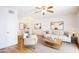 Bright living room featuring hardwood floors, modern furniture, and a ceiling fan at 5035 N 17Th Ave # 205, Phoenix, AZ 85015