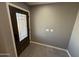 Welcoming entryway features a front door with decorative glass and neutral tile flooring at 5042 S 22Nd St, Phoenix, AZ 85040