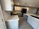 Beautiful kitchen featuring a stylish island, quartz countertops, and stainless appliances at 5042 S 22Nd St, Phoenix, AZ 85040
