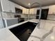 Modern kitchen features quartz countertops, stainless steel appliances and a stylish faucet at 5042 S 22Nd St, Phoenix, AZ 85040