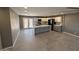 Spacious kitchen features gray and white cabinets, stainless appliances, and a large center island at 5042 S 22Nd St, Phoenix, AZ 85040