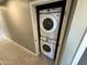 Convenient laundry area features a stacked washer and dryer set in a closet at 5042 S 22Nd St, Phoenix, AZ 85040