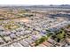 A high aerial view of the neighborhood showcasing its proximity to stores, highway and mountains at 512 E Bamboo Ln, San Tan Valley, AZ 85140