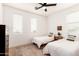 Inviting bedroom featuring two twin beds, natural light, and a cozy rug for a welcoming atmosphere at 512 E Bamboo Ln, San Tan Valley, AZ 85140