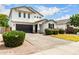Charming two-story home featuring a black garage door and manicured landscaping at 512 E Bamboo Ln, San Tan Valley, AZ 85140