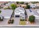Charming two-story home boasting modern architecture, lush landscaping, and a spacious paved driveway at 512 E Bamboo Ln, San Tan Valley, AZ 85140