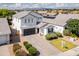Beautiful two-story home with well-maintained landscaping, a paved driveway, and a contemporary design at 512 E Bamboo Ln, San Tan Valley, AZ 85140