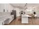 Bright kitchen with white cabinetry, stainless steel appliances, and an island with barstool seating at 512 E Bamboo Ln, San Tan Valley, AZ 85140