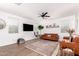 Cozy living area featuring comfortable seating, a modern TV, and stylish accents at 512 E Bamboo Ln, San Tan Valley, AZ 85140