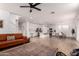 Open concept living room and kitchen with hardwood floors and plenty of natural light at 512 E Bamboo Ln, San Tan Valley, AZ 85140