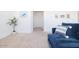 Cozy upstairs loft area featuring a comfortable couch and neutral decor, creating a relaxing space at 512 E Bamboo Ln, San Tan Valley, AZ 85140