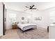 Serene main bedroom with a sliding barn door, plush rug, and soothing neutral tones at 512 E Bamboo Ln, San Tan Valley, AZ 85140