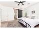 Relaxing main bedroom with a sliding barn door to bathroom, plush rug, and serene neutral tones at 512 E Bamboo Ln, San Tan Valley, AZ 85140