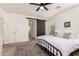 Bright main bedroom featuring a sliding barn door to the ensuite at 512 E Bamboo Ln, San Tan Valley, AZ 85140