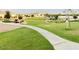 A smooth walking path invites residents to enjoy a stroll through this well-maintained community park at 512 E Bamboo Ln, San Tan Valley, AZ 85140