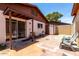 Cozy backyard with painted concrete, block fence, covered patio, and direct access to the home interior at 5135 E Evergreen St # 1166, Mesa, AZ 85205