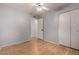 Bedroom featuring hardwood floors, light blue walls, and closet at 5135 E Evergreen St # 1166, Mesa, AZ 85205