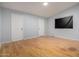 Spacious bedroom with light blue walls and hardwood floors, plus two doors and a window at 5135 E Evergreen St # 1166, Mesa, AZ 85205