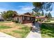 Well-maintained single story home features mature landscaping and a sidewalk at 5135 E Evergreen St # 1166, Mesa, AZ 85205