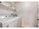 Laundry room featuring washer, dryer, and shelves for storage at 5135 E Evergreen St # 1166, Mesa, AZ 85205