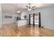 Bright living room with wood floors, ceiling fan, and sliding glass doors at 5135 E Evergreen St # 1166, Mesa, AZ 85205