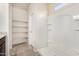This bathroom offers an enclosed shower, shelves, and neutral-colored walls at 5240 E Gummite Dr, San Tan Valley, AZ 85143