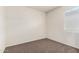 This bedroom features neutral walls, brown carpeting, and a window with white blinds at 5240 E Gummite Dr, San Tan Valley, AZ 85143