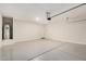 Spacious garage with painted floor and ample room for parking and storage at 5240 E Gummite Dr, San Tan Valley, AZ 85143