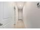 Bright hallway with white walls and trim, and neutral-toned flooring at 5240 E Gummite Dr, San Tan Valley, AZ 85143