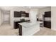 Stylish kitchen with stainless steel appliances, granite countertops, and dark cabinetry at 5240 E Gummite Dr, San Tan Valley, AZ 85143