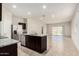 Modern kitchen with stainless steel appliances, a center island, and granite countertops at 5240 E Gummite Dr, San Tan Valley, AZ 85143