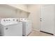 Clean laundry room with washer, dryer, and overhead shelving for storage at 5240 E Gummite Dr, San Tan Valley, AZ 85143