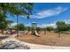 Community playground featuring slides, climbing structures, and shaded picnic area for outdoor fun at 5240 E Gummite Dr, San Tan Valley, AZ 85143